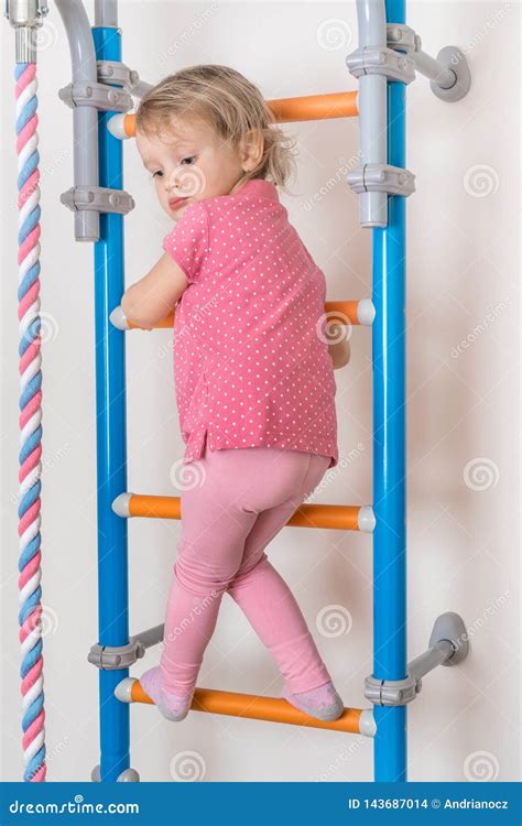 Little Happy Girl Climbing The Ladder Stock Photo Image Of Cheerful