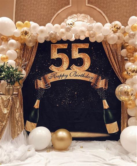 A 50th Birthday Backdrop With Balloons And Streamers In Gold White And