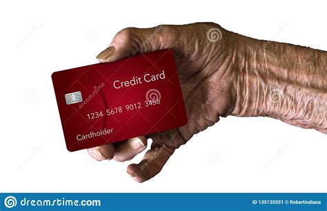 Because of the risks involved, these financial products are not offered to every individual. An Elderly Hand Holds A Credit Card To Illustrate The ...