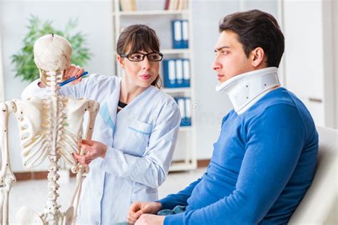 The Doctor Is Explaining To Patient With Neck Injury Stock Photo