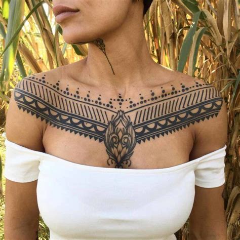 60 Gorgeous Girly Tattoos Thatll Convince You To Get Inked Chest Tattoos For Women Tribal