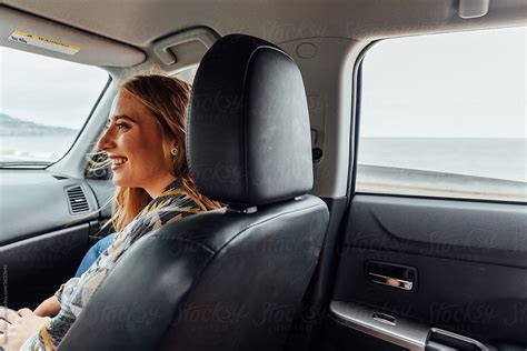 Woman Sitting In Passenger Seat By Stocksy Contributor Jayme Burrows