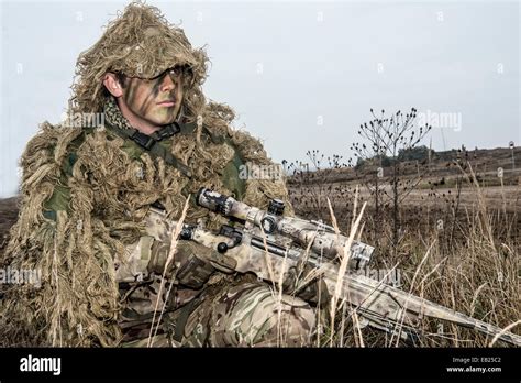 British Sniper With His L115a3 Long Range Sniper Rifle On Exercise In