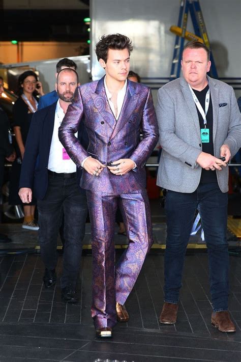 Harry Styles Is The Prince Of Fashion In This Purple Metallic Suit At