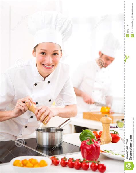 Young Attractive Professional Chef Cooking In His Kitchen Stock Photo