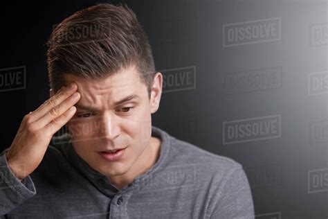 Portrait Of A Worried Young White Man Looking Down Stock Photo Dissolve