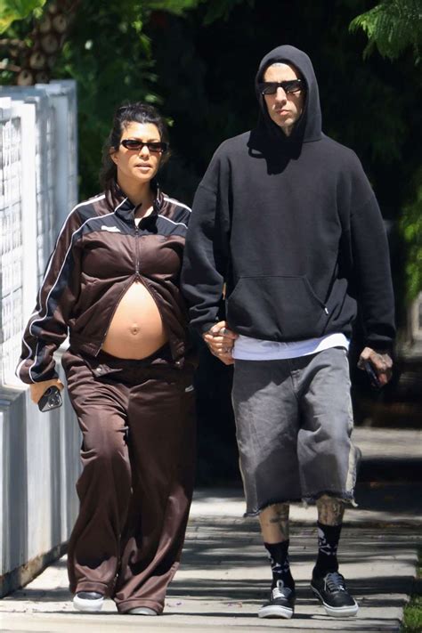 Pregnant Kourtney Kardashian Shows Bare Baby Bump On Walk With Travis
