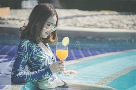 Beautiful Asain Women With Bikini Enjoy Summer Vacation In The Swimming Pool Stock Image