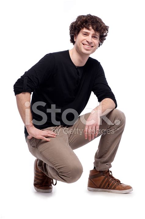 Young Man Crouching Stock Photo Royalty Free Freeimages