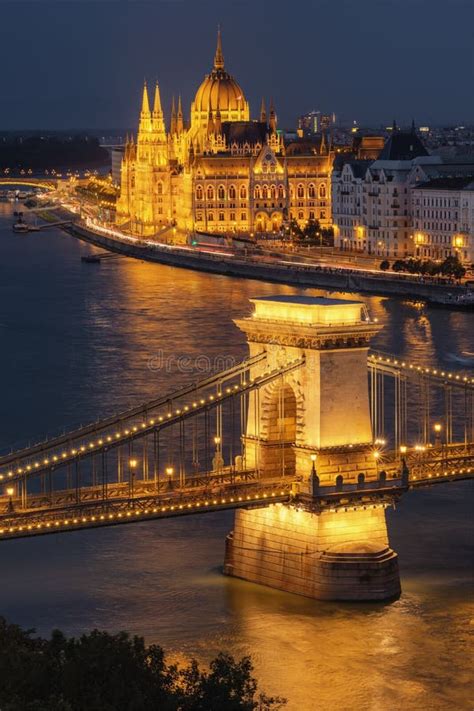 Chain Bridge And The Parliament Building At Night In Budapest Stock