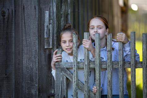 Portraits Of Two Girls Friends In Village Outdoors Fun Stock Image