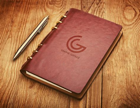 Leather Notebook Cover With Emboss Logo Mockup On Wooden Surface Free