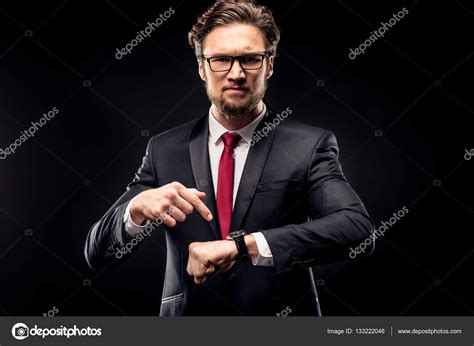 Businessman Pointing At Wristwatch — Stock Photo © Dmitrypoch 133222046