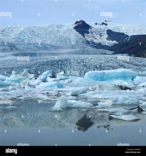 Jokulsarlon Glacial Lagoon Filled With Floating Icebergs And Glacier