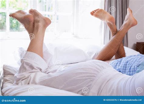 Couples Legs Lying On Bed Stock Photo Image Of Calm 42533376