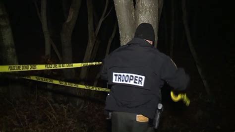 state police investigate homicide after hunters find body in woods