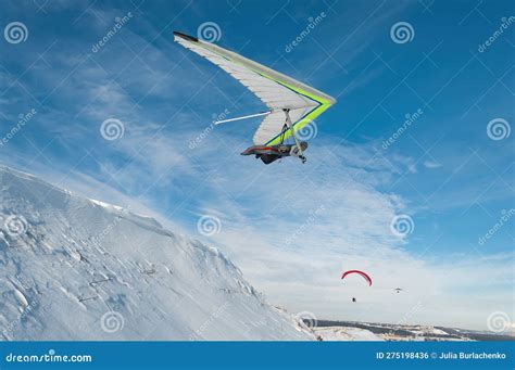 Hang Glider Pilot Launches From The Snow Cliff Stock Photo Image Of