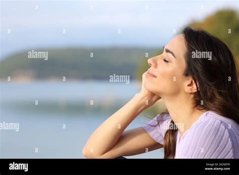 Happy Woman Relaxing In A Lake Stock Photo Alamy