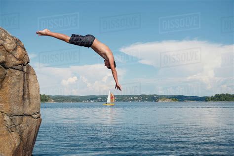 Man Jumping Into Sea Stock Photo Dissolve