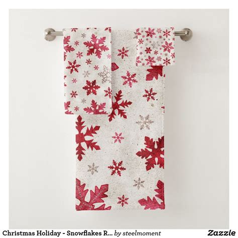 Two Red And White Towels Hanging On A Towel Rack With Snowflakes