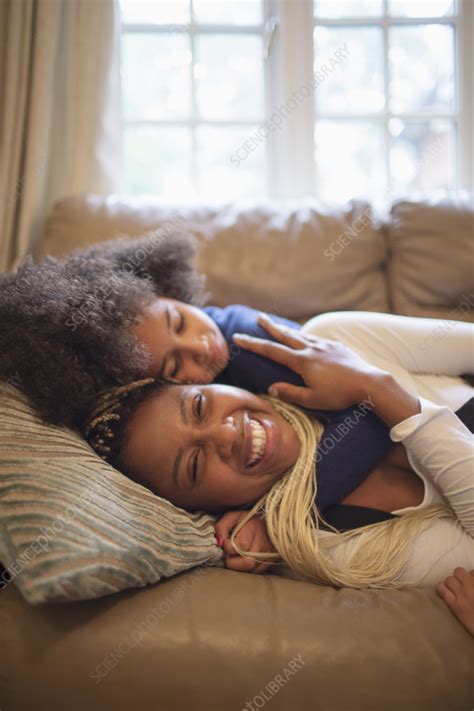 Happy Mother And Daughter Cuddling On Living Room Sofa Stock Image F0361174 Science Photo