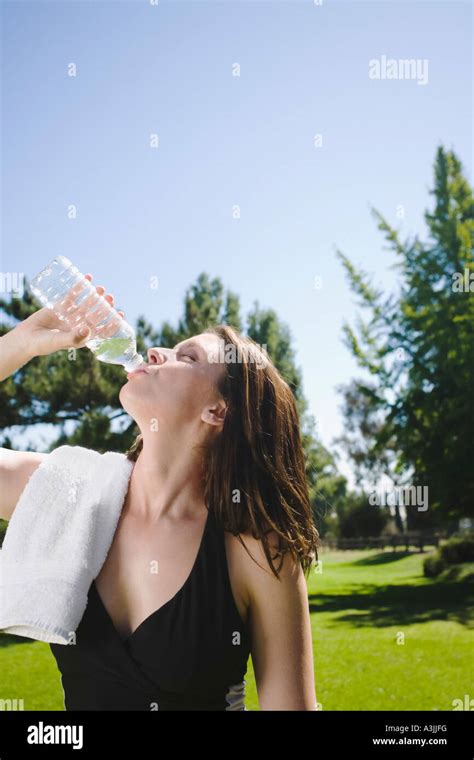Woman Drinking Bottled Water Stock Photo Alamy