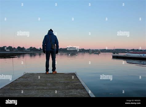 Man On A Jetty Stock Photo Alamy