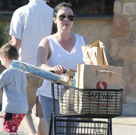 I still have 'a lot of life' in me amid stage 4 cancer battle. Barefaced trolley chic: Shannen Doherty looks a far cry ...