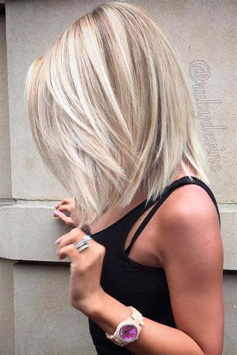 The layered bob cut ends just below the chin, so you can create lots of extra volume from tousled waves. Picture Of ashy blonde long bob hair