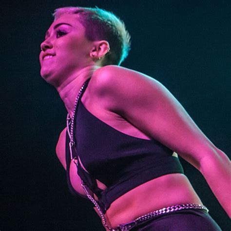 Miley Cyrus Rocks The Stage With Topless Dancer E Online