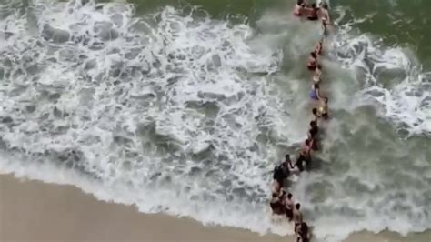 Video Human Chain Formed To Rescue Swimmer YouTube