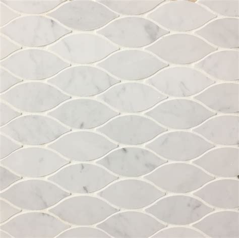 Beautiful interlocking ring pattern makes an elegant statement in any kitchen or bathroom. Elongated Teardrop Waterjet Tile Carrara Marble Mosaic