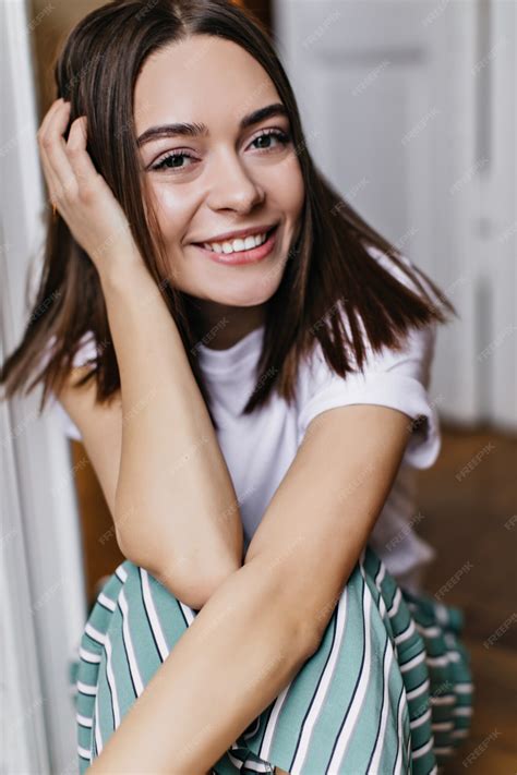 Free Photo Carefree Girl With Big Brown Eyes Laughing While Sitting At Home Indoor Photo Of