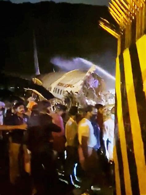 Pictures Dubai Kerala Air India Express Flight Crashes Splits Into