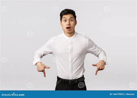 Freak Out Alarmed And Surprised Shocked Asian Handsome Guy In Collar Shirt Pants Pointing