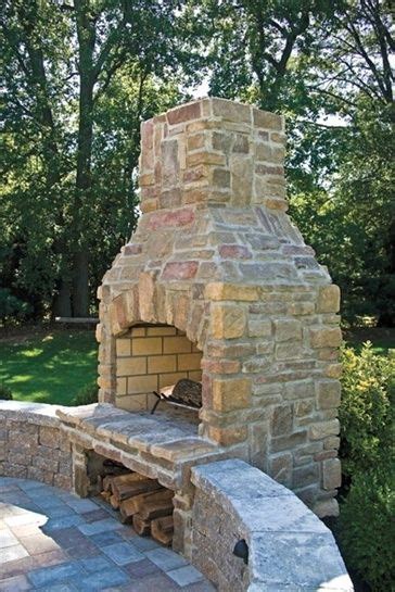 The smoke that comes off of green or unseasoned wood is energy that's going up the chimney instead of being translated into heat for your home. Outdoor fire place with wood storage underneath | Outdoor fire