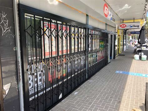 Atdc Expandable Security Shutters Secure Iga Stores Australia Wide