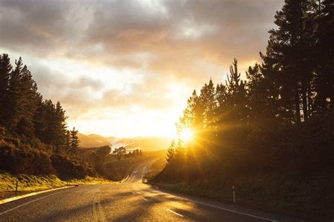 Winding Road In Front Of Sunset North Island New Zealand Road Sunset