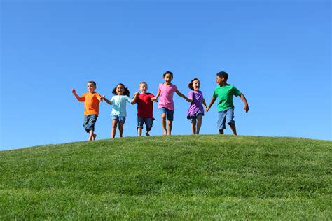 Children Playing In Field