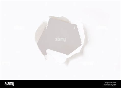 Hole In Paper Wall Stock Photo Alamy