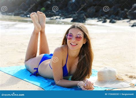 Bikini Girl Lying Down Suntan On Towel Beach Looking To The Side