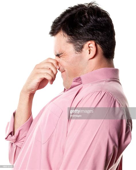 Man Pinching Nose Side View High Res Stock Photo Getty Images
