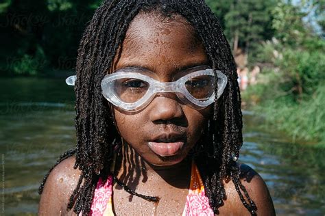 African American Girl With Swimming Goggle At A Beach By Stocksy