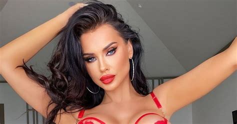 Model Gets Fans Fired Up As She Unleashes Curves In Skimpy Red Room