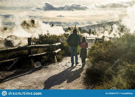 People In Geothermal Volcanic Park With Geysers And Hot Streams Scenic