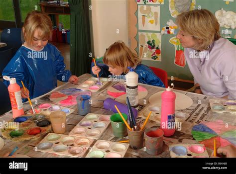 Children Painting At Nursery School Stock Photo Alamy