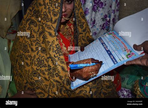 Indian Muslim Bride Signing The Nikah Nama Or Marriage Contract An