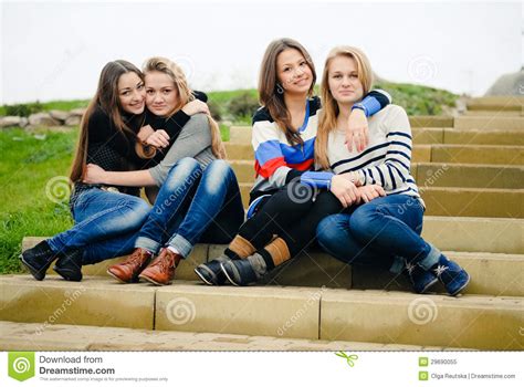 Four Happy Teen Girls Friends Hug And Having Fun Stock Image