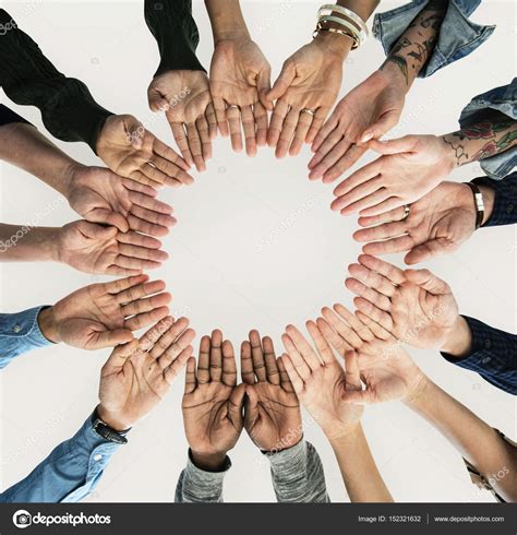 People Holding Hands Together In A Circle