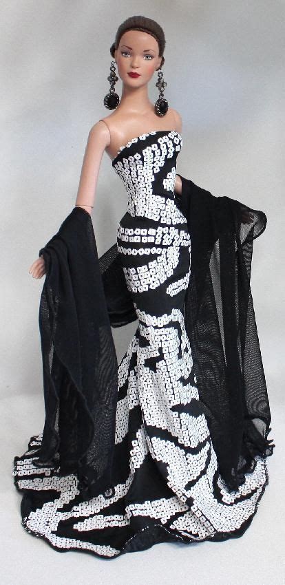A Barbie Doll Wearing A Black And White Dress